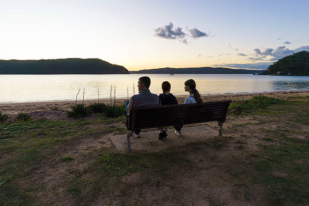istock Father and Daughters Enjoying Sunset at Palm Beach, NSW 2238456867