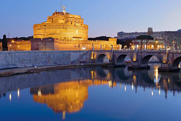Rome, Italy, January 30 -- The evening lights conquer the scene of the majestic Castel Sant'Angelo and its bridge. Built around 123 AD as a sepulcher for the emperor Hadrian and his family, the current Castel Sant'Angelo was used by the Popes as a fortress, prison and refuge. It is currently owned by the Italian state and is used for visits and cultural events.