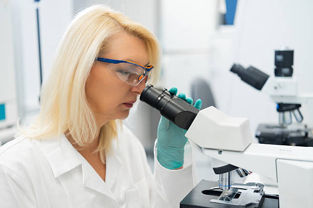 istock Scientists performing detailed medical research using a microscope in a modern laboratory setting 2238463901