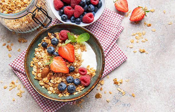istock Granola bowl with fresh berries yogurt and nuts 2238464630