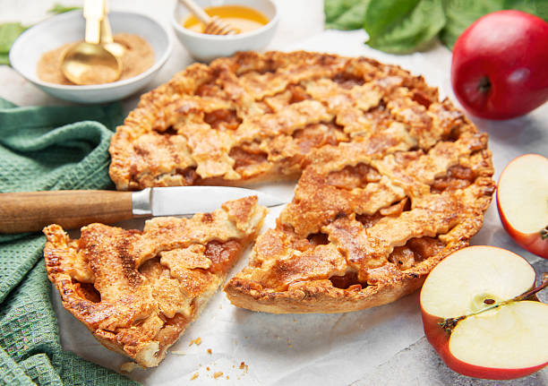 istock Homemade apple pie with ingredients on concrete background 2238464650