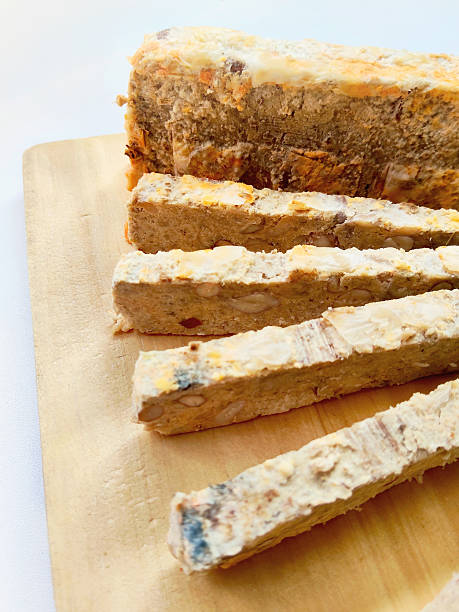 istock Close View of Baked or Dried Oncom Snack Slices with Almonds 2238466390