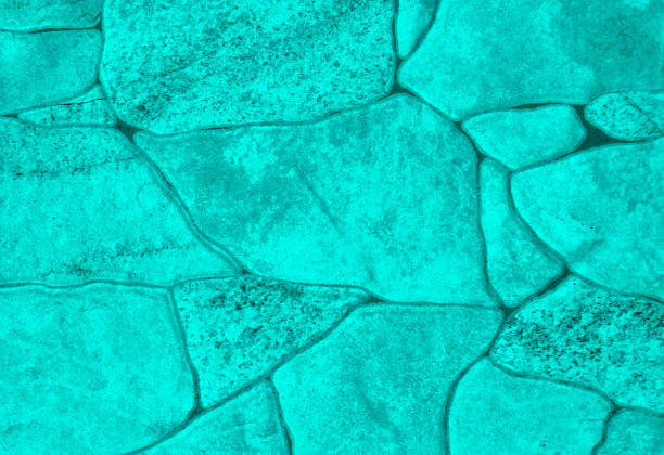 Vibrant turquoise stone wall texture featuring irregular shaped natural rocks in brilliant aqua blue and cyan tones with subtle surface variations. This tropical-inspired background showcases organic stone formations with luminous color saturation, textured details, and flowing patterns perfect for beach resort branding, vacation rental marketing, tropical destination campaigns, spa and wellness centers, summer fashion collections, beachwear advertising, coastal real estate, Caribbean themed content, poolside hospitality designs, and modern lifestyle brands. The ultra-high resolution image captures authentic geological characteristics, natural weathering patterns, and electric color intensity that brings energy and freshness to any visual project. Excellent for designers seeking vibrant, cheerful backgrounds for travel industry materials, leisure and recreation promotions, island getaway concepts, or any application requiring an uplifting, paradise-inspired aesthetic with natural beauty and contemporary appeal.