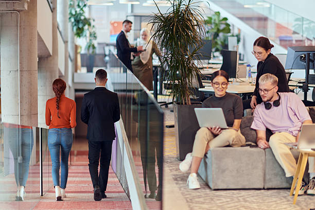 istock In a modern startup office, a diverse group of young professionals collaboratively tackles various business problems and challenges, surrounded by their engaged colleagues, fostering innovation and productivity 2238469104