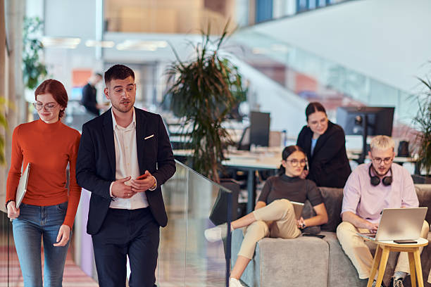 istock In a modern startup office, a diverse group of young professionals collaboratively tackles various business problems and challenges, surrounded by their engaged colleagues, fostering innovation and productivity 2238469937