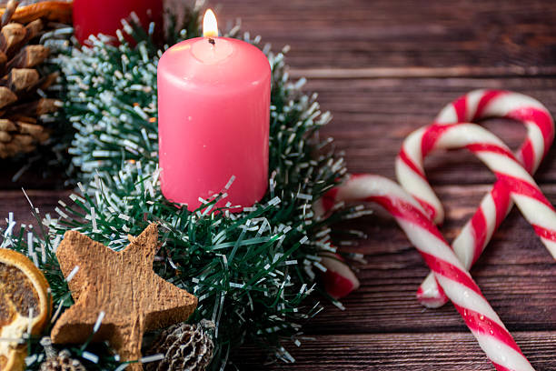 istock First Advent Candle with Christmas Decoration 2238472385