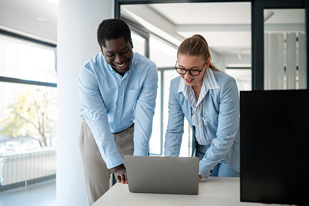 istock Business colleagues collaborating on laptop in modern office setting 2238473050