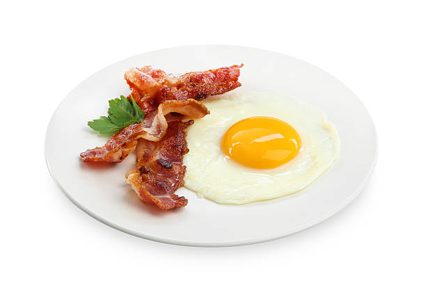 istock Delicious breakfast with sunny side up egg isolated on white 2238477770