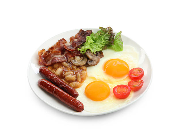 istock Delicious breakfast with sunny side up eggs isolated on white 2238477826
