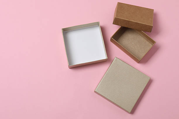 istock empty paper box with lid on pink background, top view 2238478193