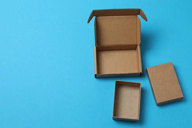 istock empty paper box with lid on blue background, top view 2238478225