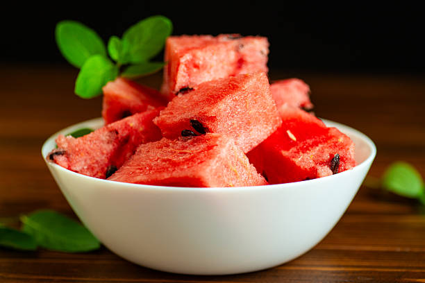 Summer watermelon dessert in a bowl on a dark background