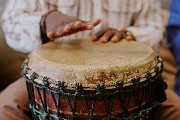 istock Black Man Playing Traditional Drum Celebrating Kwanzaa Cultural Heritage 2238482384