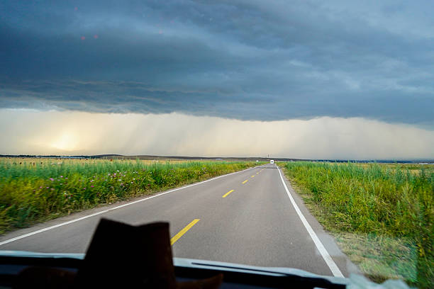 The road surface and the distant clouds