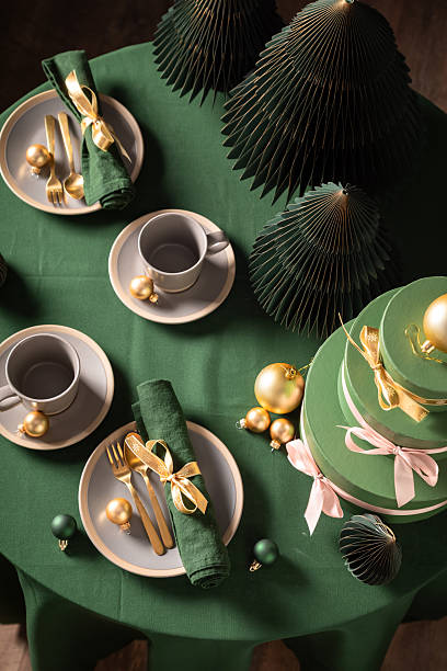 istock Top down view of green Christmas tableware for two. 2238484275