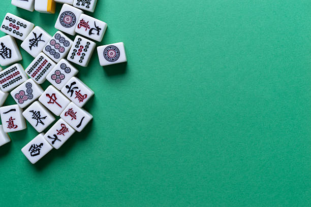 istock Mahjong tiles lined up on a green background 2238485741