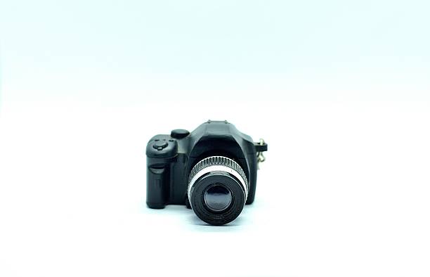 istock A detailed miniature DSLR camera model with a black body and silver-ringed lens, placed on a plain white background, showcasing realistic design elements and intricate control details 2238485929
