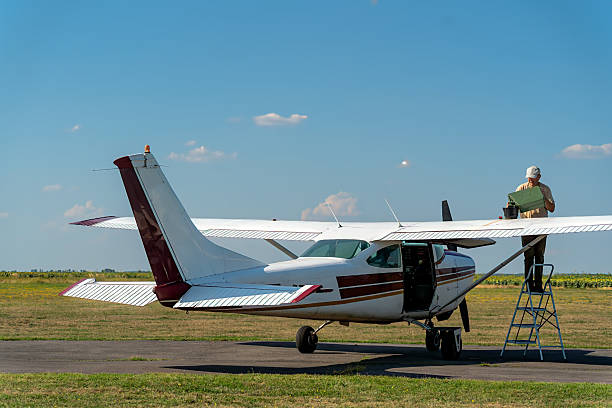 A small plane's propeller, with clear skies and mountains forming a serene backdrop, emphasizing the prospect of an aerial tour.