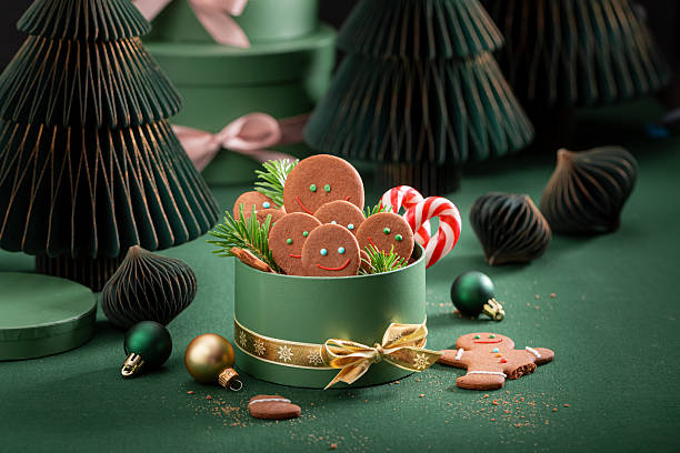 istock Cute Christmas gingerbread mans with Christmas green decorations and baubles. 2238486835