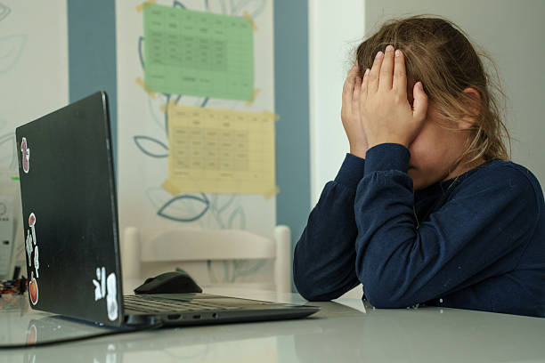 istock Child reacting emotionally to laptop screen. 2238486854