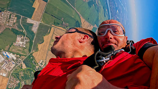 istock Tandem skydivers selfie during freefall with landscape below and adrenaline-fueled sensation 2238487266