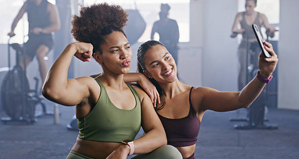 istock Two Women Taking a Selfie While Exercising in Fitness Studio 2238487405