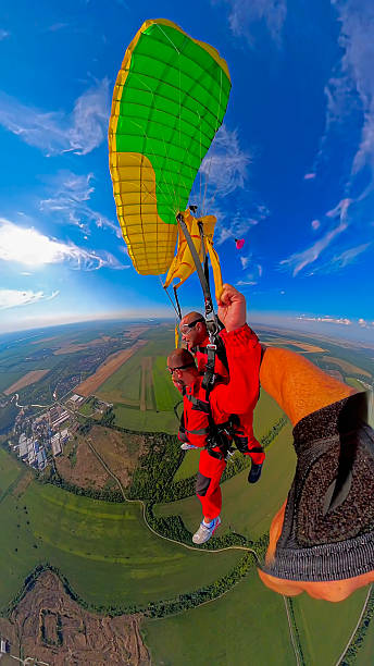 istock Tandem skydivers capture exhilarating freefall selfie with expansive earth view 2238487653