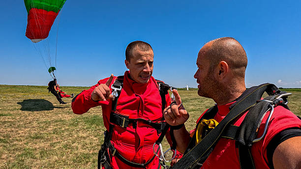 istock Tandem skydiving instructors capture a selfie during a high‑adrenaline jump in a wide open field 2238487694