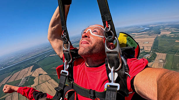 istock Tandem skydiving selfie in freefall: adrenaline rush, canopy ride, and panoramic view 2238487768