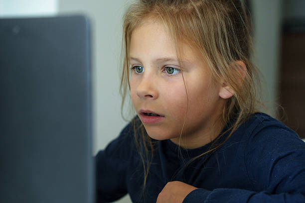 istock Child reacting emotionally to laptop screen. 2238488004