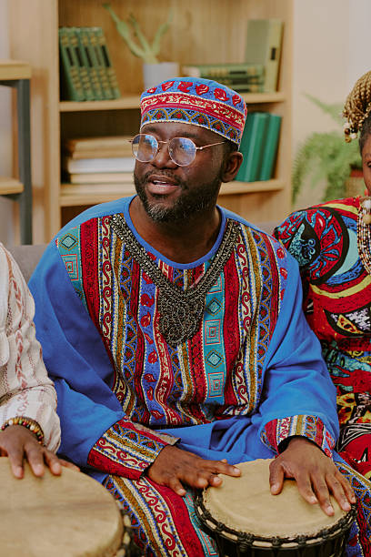 istock Middle Aged Black Man Playing Drum during Kwanzaa Celebration Indoors 2238489925