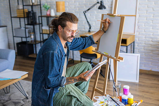 istock Focused Artist sketching ideas for a new painting at home studio 2238492796