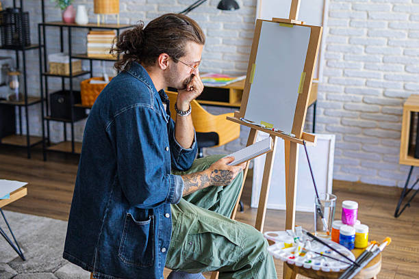istock Focused Artist sketching ideas for a new painting at home studio 2238492844