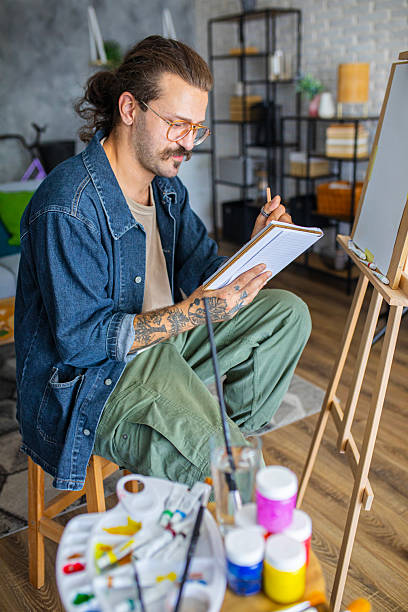 istock Artist sketching ideas for a new painting at home studio 2238493809