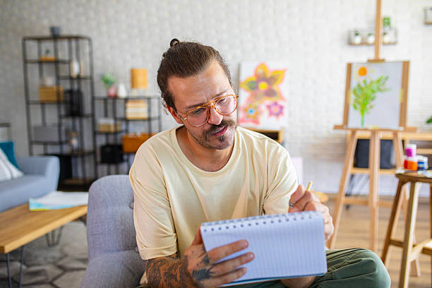 istock Focused Artist sketching ideas for a new painting at home studio 2238494520