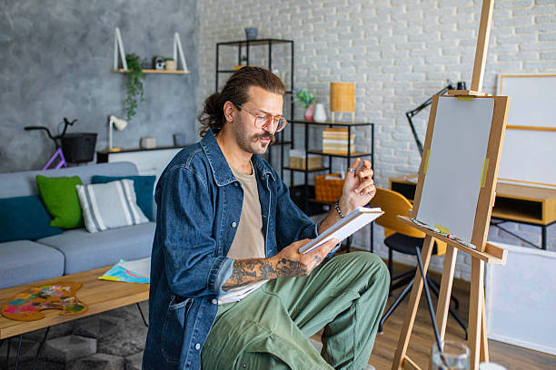 istock Artist sketching ideas for a new painting at home studio 2238496527