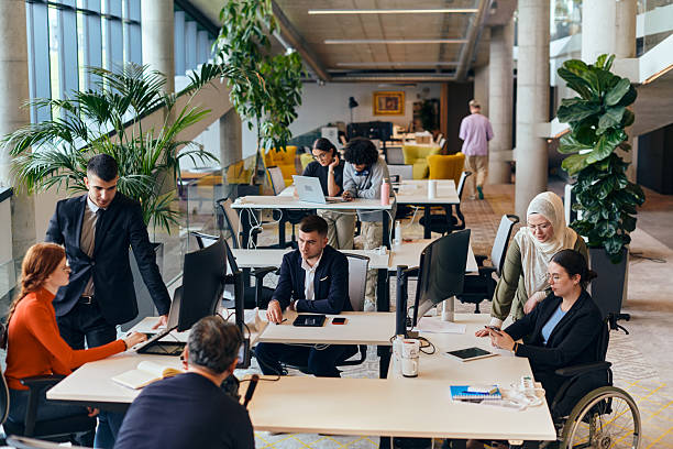 istock In a modern startup office, a diverse group of young professionals collaboratively tackles various business problems and challenges, surrounded by their engaged colleagues, fostering innovation and productivity 2238499129