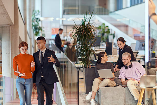 istock In a modern startup office, a diverse group of young professionals collaboratively tackles various business problems and challenges, surrounded by their engaged colleagues, fostering innovation and productivity 2238501959