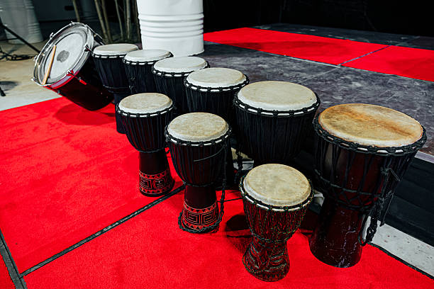 istock Row of Djembes on Red Carpet Stage 2238503681