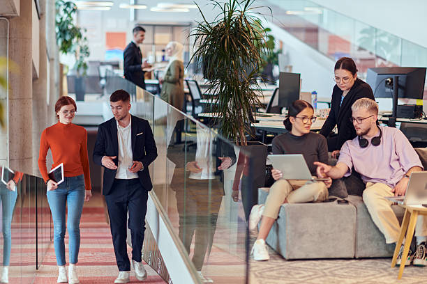 istock In a modern startup office, a diverse group of young professionals collaboratively tackles various business problems and challenges, surrounded by their engaged colleagues, fostering innovation and productivity 2238505976