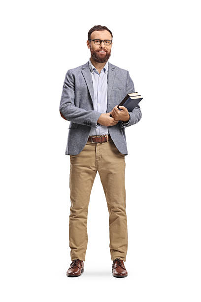 istock Bearded man standing and holding books 2238508195