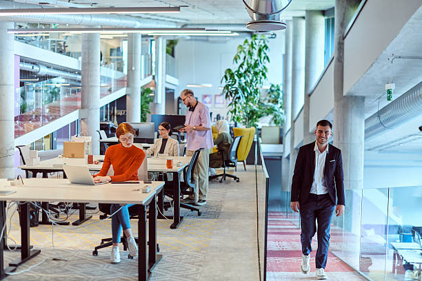 istock In a modern startup office, a diverse group of young professionals collaboratively tackles various business problems and challenges, surrounded by their engaged colleagues, fostering innovation and productivity 2238508453