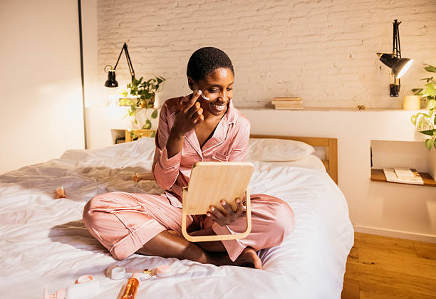 istock Woman applying face cream during bedtime skincare routine 2238509706