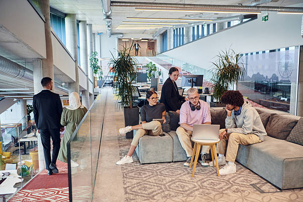 istock In a modern startup office, a diverse group of young professionals collaboratively tackles various business problems and challenges, surrounded by their engaged colleagues, fostering innovation and productivity 2238512273