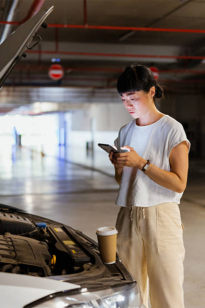 Japanese woman searches car service on her mobile