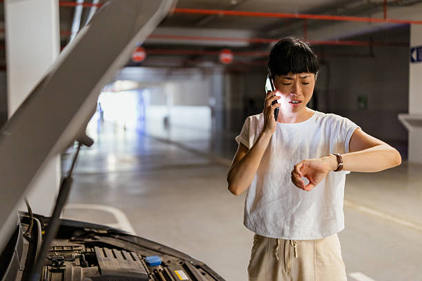 istock Japanese woman calling for help on cell phone 2238517116