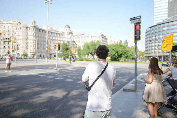 Bogotá Colombia 2 de junio de 2024:Dad walking his son in a car