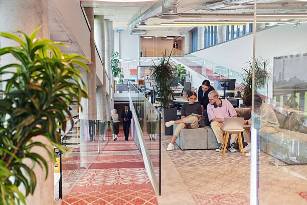 istock In a modern startup office, a diverse group of young professionals collaboratively tackles various business problems and challenges, surrounded by their engaged colleagues, fostering innovation and productivity 2238521686