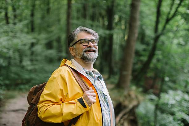 istock Mature man hiking in forest looking up enjoying nature 2238521856