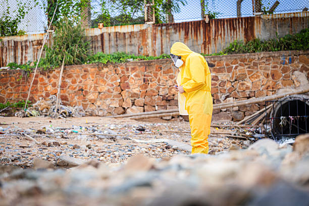 istock Hazmat Worker Inspecting Contaminated Industrial Waste Site, Environmental Scientist in PPE Suit Analyzing Soil Pollution, Chemical Expert Collecting Samples at Urban Landfill or Dump 2238523101